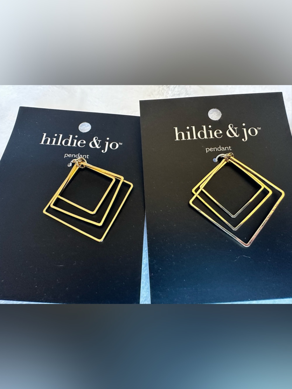 Set of two Diamond-shaped, goldtoned pendants from Hildie and Jo